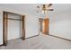 Spacious bedroom featuring a ceiling fan, closet, and new carpeting at 13 N Main St, Brooklyn, IN 46111