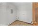 Functional laundry room with washer and dryer hookups and wire shelving at 13 N Main St, Brooklyn, IN 46111