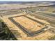Aerial view of new construction site showing land grading and road construction at 1310 Fleming Dr, Greenfield, IN 46140