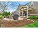 Beautiful backyard with covered patio, outdoor seating, and manicured landscaping at 1533 Windswept, Brownsburg, IN 46112