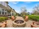 Spacious backyard with a charming patio, fire pit, and lush landscaping at 1533 Windswept, Brownsburg, IN 46112
