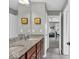 Bright bathroom with granite countertops, double sinks, and a shower at 1533 Windswept, Brownsburg, IN 46112