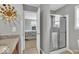 Bright bathroom with granite countertops, a shower with sliding glass doors, and modern decor at 1533 Windswept, Brownsburg, IN 46112