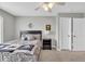 Cozy bedroom featuring a ceiling fan, closet, and comfortable bed at 1533 Windswept, Brownsburg, IN 46112
