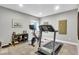 Bright exercise room features modern equipment and natural light from a window at 1533 Windswept, Brownsburg, IN 46112