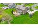 Stunning home with a spacious yard, beautiful landscaping, and a cozy outdoor patio area with a fire pit at 1533 Windswept, Brownsburg, IN 46112