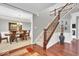 Elegant foyer with staircase, hardwood floors, and open view to the dining room at 1533 Windswept, Brownsburg, IN 46112