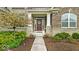 Charming front entrance with brick and stone accents, leading to a cozy home at 1533 Windswept, Brownsburg, IN 46112
