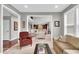 Open-concept living room with neutral tones, natural light, and comfortable seating at 1533 Windswept, Brownsburg, IN 46112