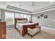 An inviting main bedroom features tray ceilings, natural light, and neutral tones at 1533 Windswept, Brownsburg, IN 46112