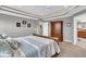 An inviting main bedroom features tray ceilings, natural light, and neutral tones at 1533 Windswept, Brownsburg, IN 46112