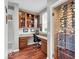Convenient home office space with custom shelving and a temperature-controlled wine storage area at 1533 Windswept, Brownsburg, IN 46112