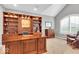 Bright office space with custom built-in shelving and a large window at 1533 Windswept, Brownsburg, IN 46112