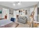 Inviting home office with comfortable seating, natural light, and art on the walls at 1533 Windswept, Brownsburg, IN 46112