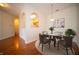 Charming dining room featuring a pendant light fixture and pass-through view to the kitchen at 1575 Sierra Springs, Carmel, IN 46280