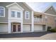 Inviting condo building with attached garages and well-maintained landscaping at 1575 Sierra Springs, Carmel, IN 46280