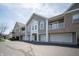 Attractive condo building featuring private garages and outdoor space at 1575 Sierra Springs, Carmel, IN 46280