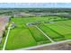 Bird's eye view of a sprawling estate featuring multiple residences, and green pastures at 1581 S 825 E, Zionsville, IN 46077