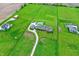 Estate aerial showcasing the large residence, fenced acreage, inground pool, outbuildings and mature landscaping at 1581 S 825 E, Zionsville, IN 46077