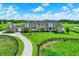 Stunning home showcasing architectural details, a horseshoe driveway, and manicured lawns, offering luxury and privacy at 1581 S 825 E, Zionsville, IN 46077