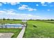 Wide aerial shot showcasing a well-maintained in-ground pool, green space and a gorgeous home at 1581 S 825 E, Zionsville, IN 46077
