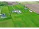 Lush green property featuring multiple homes, each with a pool, surrounded by agricultural fields at 1581 S 825 E, Zionsville, IN 46077