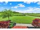 Backyard view showcases a lush green field with black fencing and mature trees at 1581 S 825 E, Zionsville, IN 46077