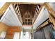 Barn ceiling featuring exposed wooden beams and construction materials, highlighting the interior's robust structure at 1581 S 825 E, Zionsville, IN 46077