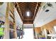 Barn ceiling with exposed wooden beams and loft construction, offering a glimpse into the structure's rustic charm at 1581 S 825 E, Zionsville, IN 46077