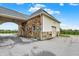 Exterior view of stone barn with drive-through access and a metal roof at 1581 S 825 E, Zionsville, IN 46077