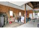 A utilitarian barn interior shows storage of materials and equipment, with access to a loft area at 1581 S 825 E, Zionsville, IN 46077