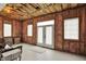 Unfinished basement with exposed ceiling beams, insulation, a door and window at 1581 S 825 E, Zionsville, IN 46077