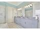 Spacious bathroom with dual sinks, marble countertops, and a glass-enclosed shower at 1581 S 825 E, Zionsville, IN 46077
