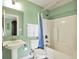 Bathroom featuring pedestal sink, shower and tub combo, and neutral paint at 1581 S 825 E, Zionsville, IN 46077