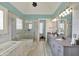 Spa-like bathroom with marble tile, soaking tub, walk-in shower, and dual vanity at 1581 S 825 E, Zionsville, IN 46077