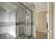 Shower behind glass door featuring tiled walls and dual shower heads at 1581 S 825 E, Zionsville, IN 46077