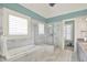 Luxurious bathroom features a soaking tub, glass shower, and abundant natural light through the window at 1581 S 825 E, Zionsville, IN 46077