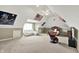 Spacious bedroom with a sofa, bed, and an American flag hanging from the ceiling at 1581 S 825 E, Zionsville, IN 46077