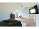 Large bedroom with sloped ceiling, ceiling fan, carpet and an ensuite bathroom at 1581 S 825 E, Zionsville, IN 46077