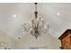 Elaborate chandelier hangs from vaulted ceiling with recessed lighting in luxurious estate home at 1581 S 825 E, Zionsville, IN 46077