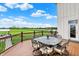 Outdoor deck space with an outdoor dining table and chairs with a beautiful yard view at 1581 S 825 E, Zionsville, IN 46077