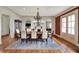 Formal dining room with hardwood floors, a decorative chandelier, and elegant furnishings at 1581 S 825 E, Zionsville, IN 46077