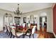 Dining room featuring hardwood floors, a chandelier, and an adjoining butler's pantry at 1581 S 825 E, Zionsville, IN 46077