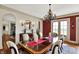 Dining room featuring hardwood floors, a chandelier, and access to the kitchen at 1581 S 825 E, Zionsville, IN 46077
