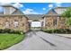 Elegant stone archway over driveway entrance, leading to a beautifully landscaped property at 1581 S 825 E, Zionsville, IN 46077