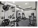 Well-equipped exercise room with weight machines, elliptical trainers, and mirrored wall at 1581 S 825 E, Zionsville, IN 46077