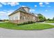 Beautiful stone and siding home with lush landscaping and a well-maintained lawn under a bright blue, cloudy sky at 1581 S 825 E, Zionsville, IN 46077