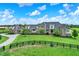 Expansive stone home features a long driveway and lush green lawn at 1581 S 825 E, Zionsville, IN 46077