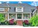 Inviting stone home with double front doors, porch and brick steps at 1581 S 825 E, Zionsville, IN 46077