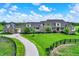 Expansive stone home features a long driveway and lush green lawn at 1581 S 825 E, Zionsville, IN 46077